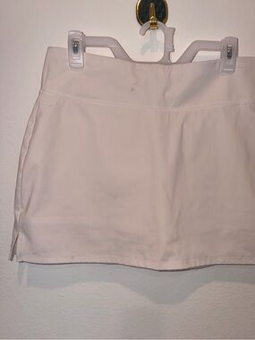 Calvin Klein Performance women's athletic skort in a clean, minimalist white hue